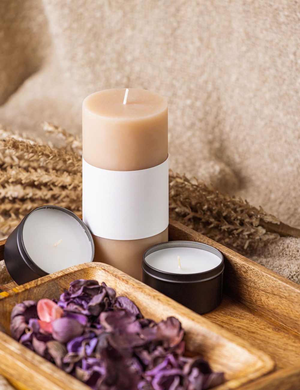 Candle, linen and warm textures set for a home spa session